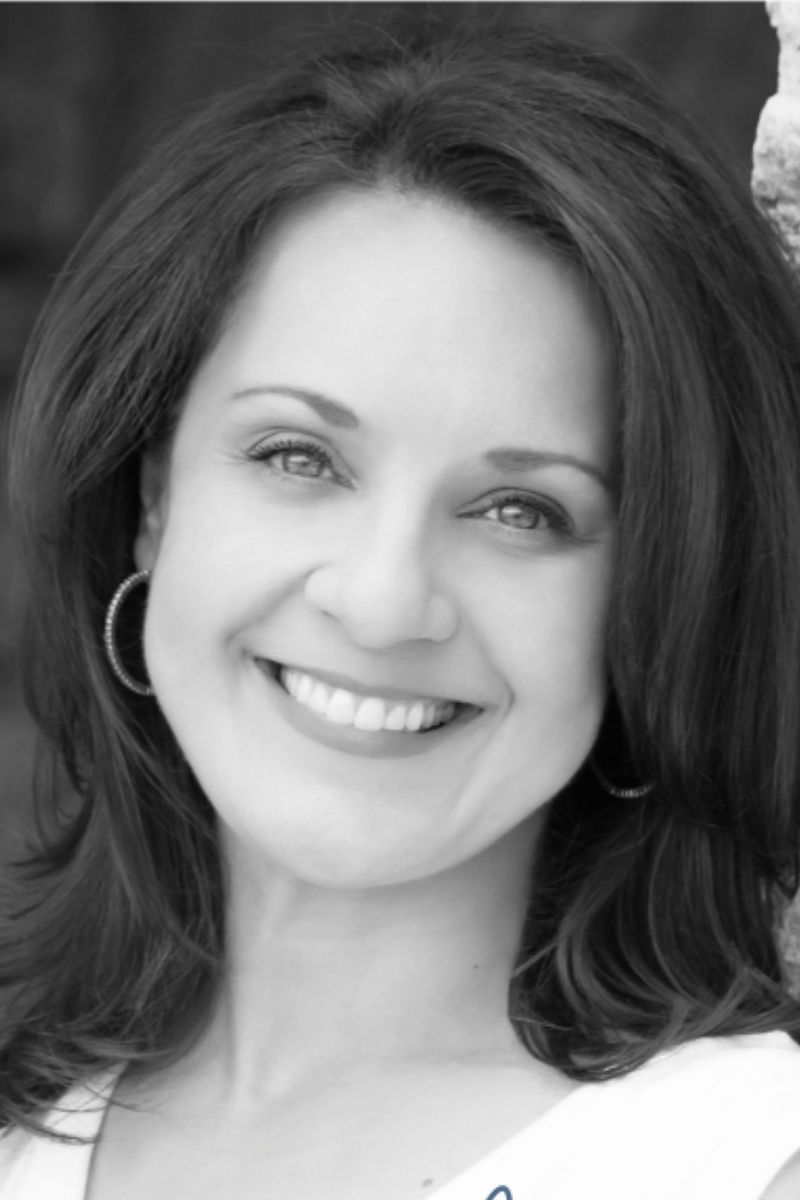 Black-and-white portrait of Cathy Pope smiling